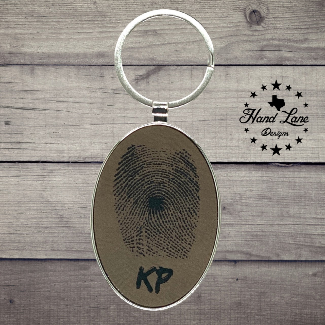 3" x 1 3/4" Laserable Leatherette/Metal Dark Brown Oval Keychain