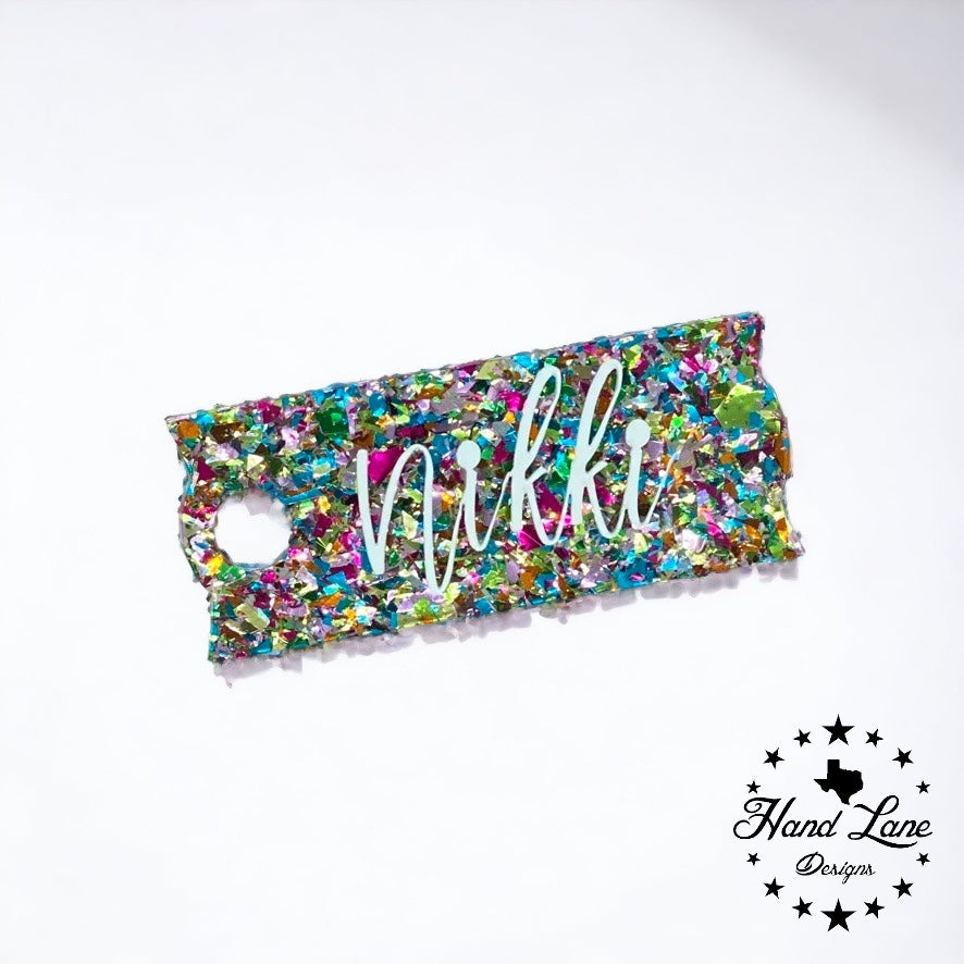 Rainbow confetti glitter acrylic Stanley name plate topper with Nikki in white script lettering