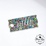 Rainbow confetti glitter acrylic Stanley name plate topper with Nikki in white script lettering