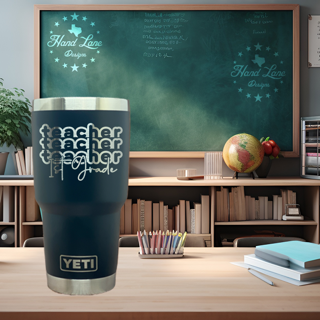 Navy 30oz Yeti tumbler engraved with stacked teacher 1st grade pencil design, classroom backdrop