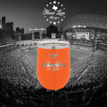 Orange stemless wine tumbler engraved with Astros star logo World Series Champions 2022, Minute Maid Park behind