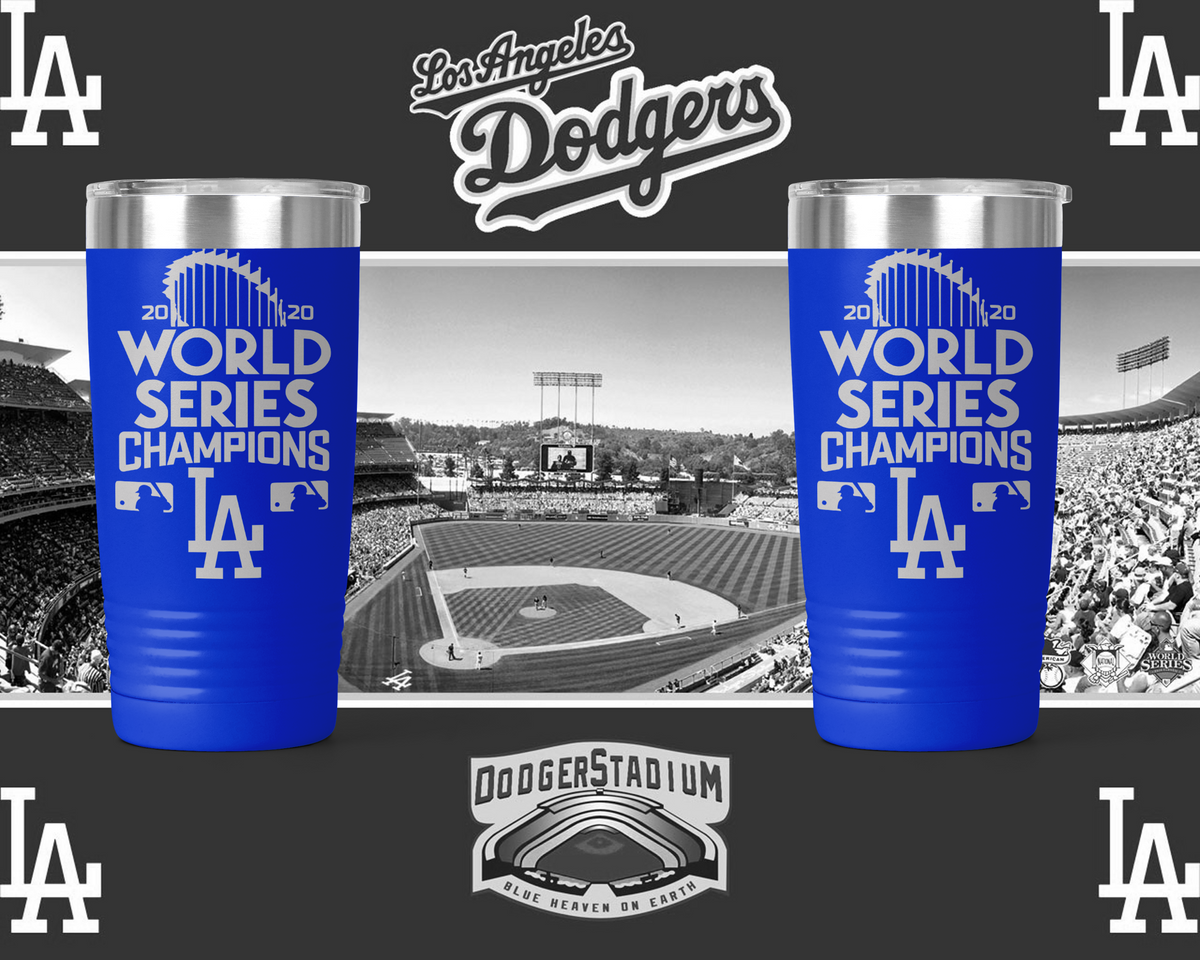 Two royal blue tumblers engraved 2020 World Series Champions LA Dodgers shown against a Dodger Stadium backdrop