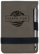 Gray leatherette mini notepad with pen, custom engraved Ocean Side realty group logo