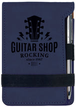 Navy blue leatherette mini notepad with pen, engraved vintage guitar shop logo design