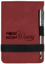 Rose leatherette mini notepad with pen showing custom engraved winery logo