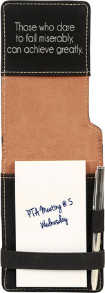 Black leatherette mini notepad opened to show paper pad, pen, and engraved quote inside cover