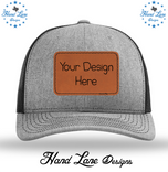 Heather gray and black Richardson 112 trucker hat with rawhide leatherette patch reading Your Design Here