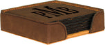 Dark brown square leatherette coaster set stacked in holder with engraved PMB monogram on top