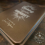 Copper 13x9 cake pan lid engraved Baking Spirits Bright with starburst and From the Kitchen of name, angled view