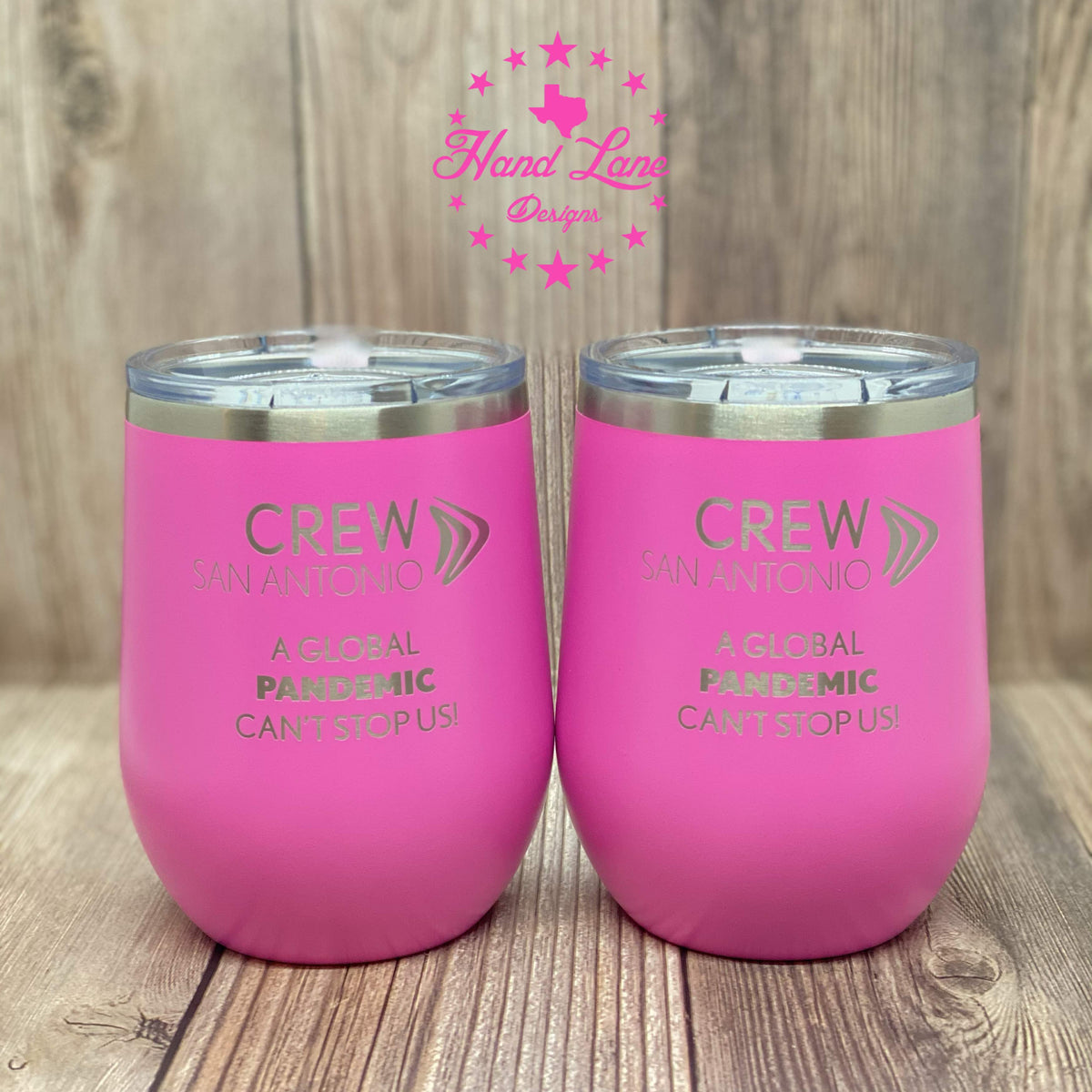 Two pink Polar Camel stemless wine tumblers laser engraved with Crew San Antonio design, lids on
