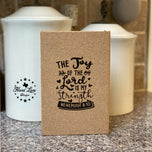 Custom engraved cork journal with The Joy of the Lord is my Strength Nehemiah 8:10 design on a kitchen counter