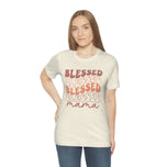 Woman wearing the natural cream Blessed Mama shirt with wavy retro Blessed print