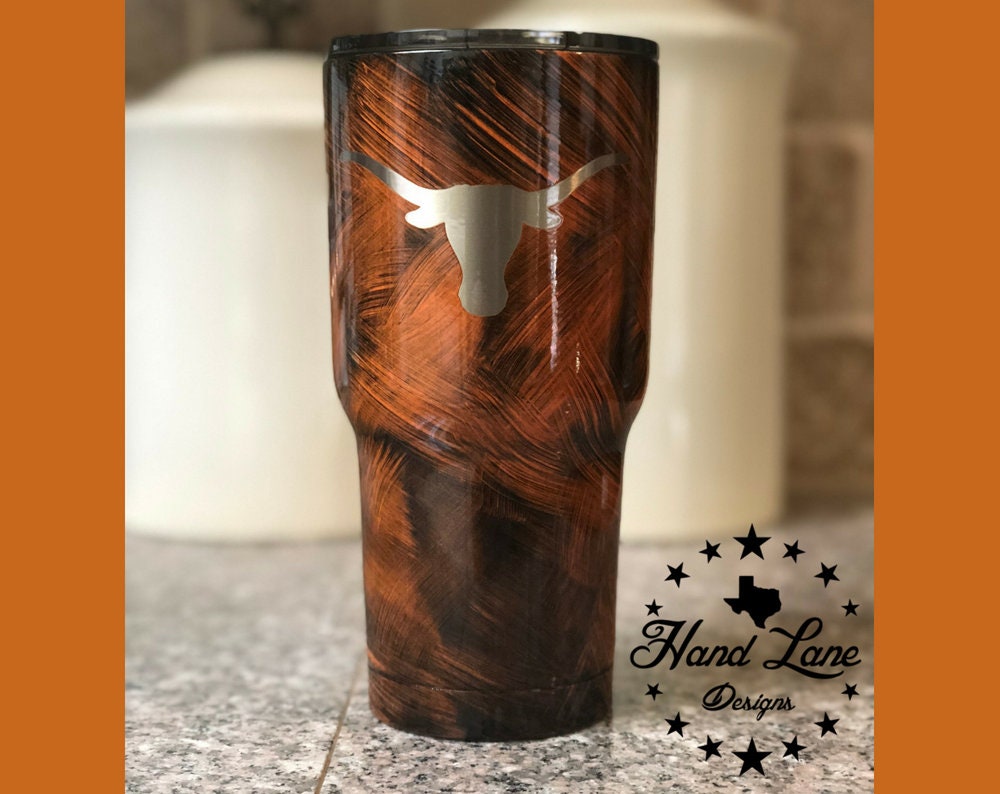 Burnt orange grunge powder coated tumbler laser engraved with Texas Longhorns logo
