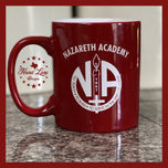 Red 11oz ceramic mug with white Nazareth Academy 1867 crest, custom school spirit coffee mug