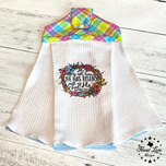 Easter waffle hanging tea towel printed with He Has Risen floral wreath and pastel plaid button top