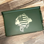Olive green 50 cal ammo can lid engraved with hands tearing open to reveal an American flag design